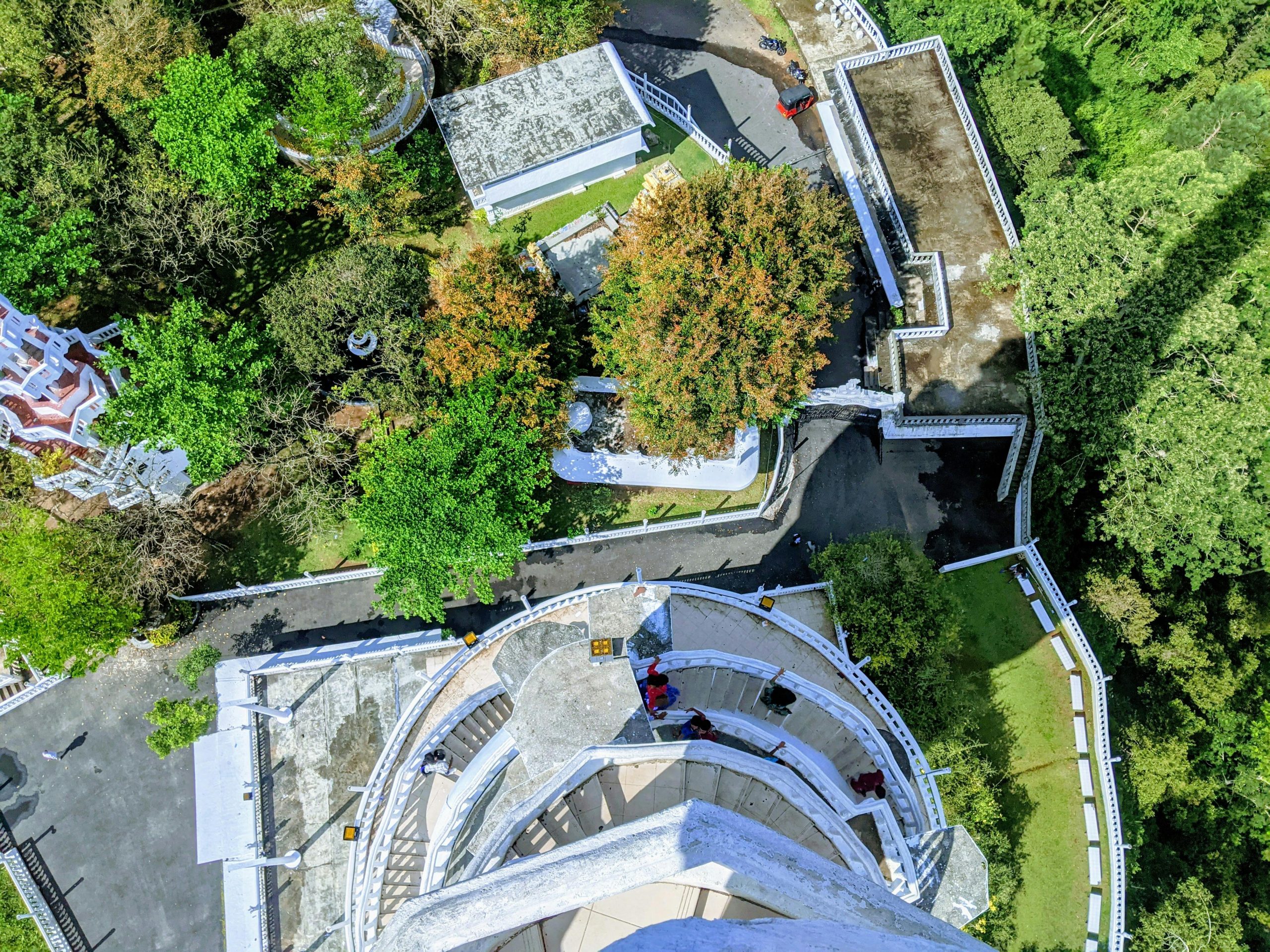 High angle view of Ambuluwawa Tower and surrounding greenery in Sri Lanka, captured in summer.